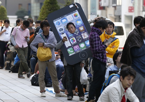 An iPhone fan waits outside an Apple Store to purchase Appleu00e2u20acu2122s new iPhone 5S at Tokyou00e2u20acu2122s Ginza shopping district September 20, 2013. u00e2u20acu201d Reuters pic