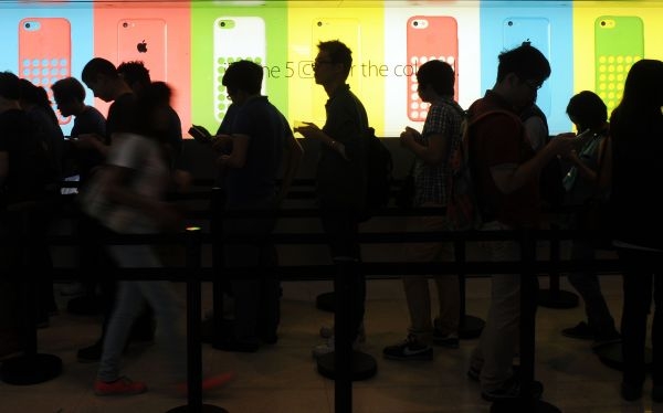 People queue outside an Apple store to purchase the new iPhone 5s and 5c in Hong Kong on Sept 20, 2013. u00e2u20acu201d AFP pic