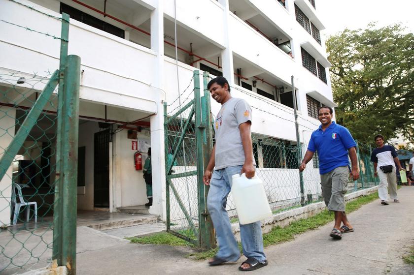 Workers returning home to the Air Biru foreign workers enclave, Iskandar Malaysia's pilot housing project for migrant workers in the region. u00e2u20acu201d Picture by Choo Choy May