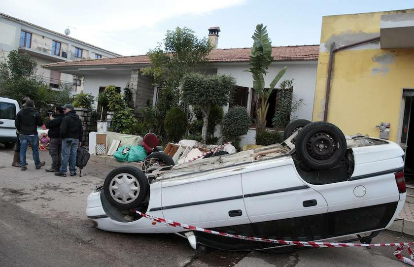 An overturned car is seen on a road following extreme rainfall in Olbia on Sardinia island November 20, 2013. u00e2u20acu201d Reuters pic