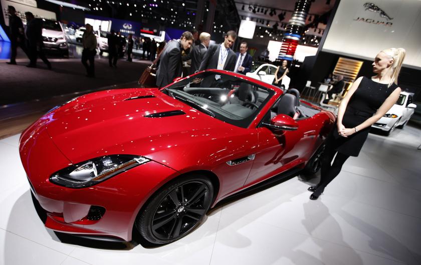 A model stands next to a Jaguar F Type S convertible model, winner of the 2013 World Car Awards World Car Design of the Year at the 2013 New York International Auto Show, March 28, 2013.u00e2u20acu201d Reuters pic