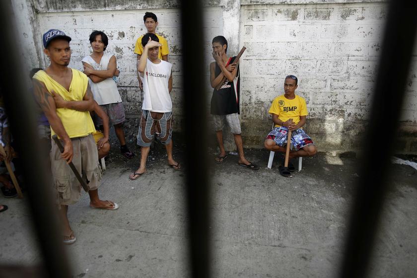 Inmates stand behind bars of the Tacloban City Jail November 19, 2013. u00e2u20acu2022 Reuters pic