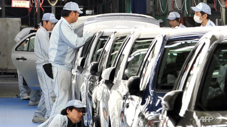 Japanu00e2u20acu2122s industrial production rose 1.5 per cent month-on-month as demand among Japanese consumers for electronics and cars rose ahead of a sales tax hike next year. u00e2u20acu201d AFP pic