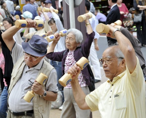 Elderly people work out with wooden dumb-bells in the grounds of a temple in Tokyo in 2009 to celebrate Japanu00e2u20acu2122s Respect-for-the-Aged-Day. u00e2u20acu201d AFP pic