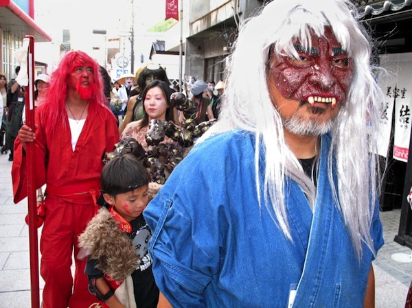 Wearing ghost costumes, participants in u00e2u20acu02dcWorld Ghost Conferenceu00e2u20acu2122 march to the sound of bamboo flutes and hand drums at Miyoshi city in Hiroshima prefecture, some 630 kilometers southwest of Tokyo 27 August 2006. u00e2u20acu201d AFP pic