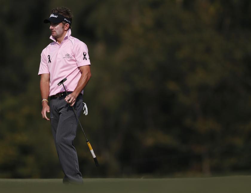 Jbe Kruger of South Africa, wearing black ribbons in memory of the late South African anti-apartheid hero Nelson Mandela, looks on after putting at the 10th green during the second day of the European Tour Hong Kong Open golf tournament December 6, 2013. 