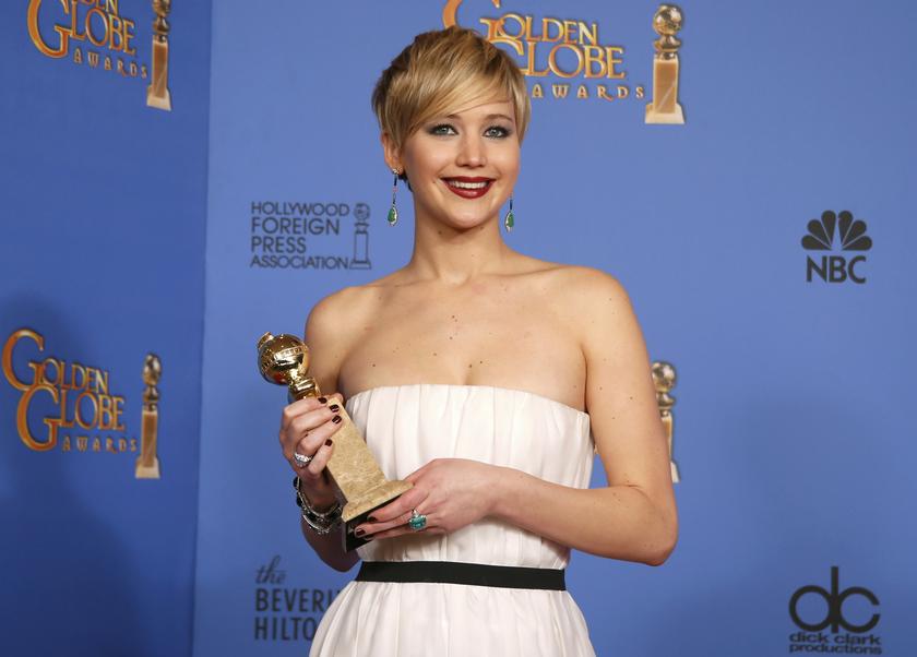 Actress Jennifer Lawrence poses with her award for Best Supporting Actress in a Motion Picture for her role in the film u00e2u20acu02dcAmerican Hustleu00e2u20acu2122 backstage at the 71st annual Golden Globe Awards in Beverly Hills, California January 12, 2014. u00e2u20acu201d Reuters pic