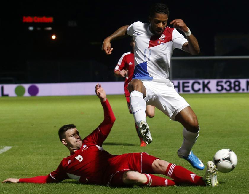 Netherlands' Jeremain Lens (right) fights for the ball with Andorra's Emili Garcia during their 2014 World Cup qualifying soccer match at Estadi Comunal in Andorra Sept 10, 2013. u00e2u20acu201d Reuters pic