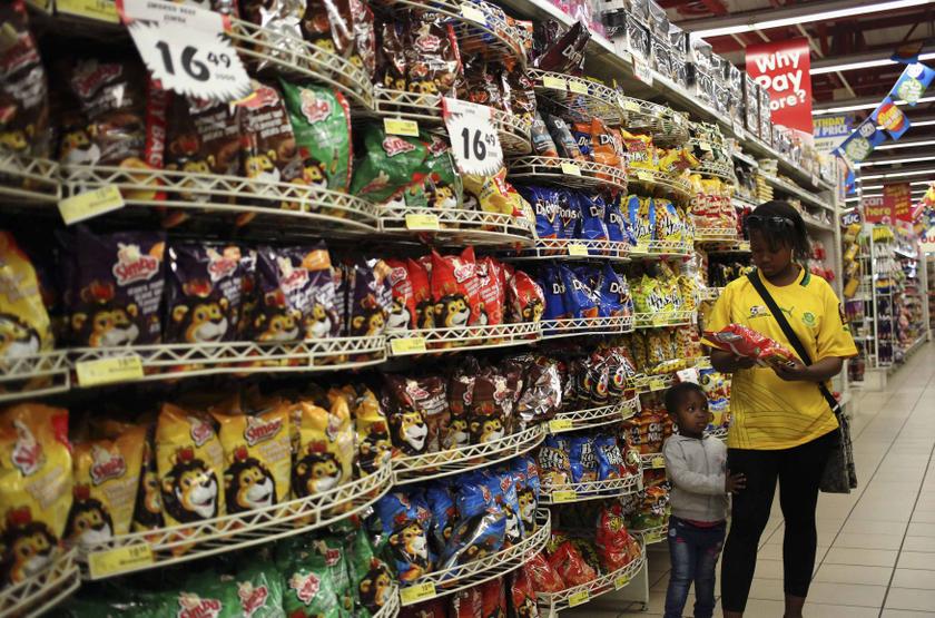 A customer shops for food items with a child, at a Shoprite store in Johannesburg, September 7, 2013. u00e2u20acu201d Reuters pic