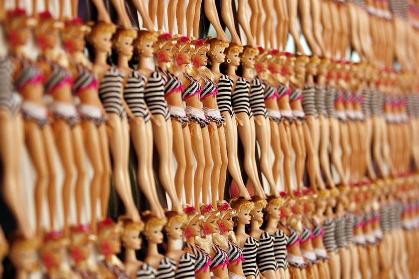 Barbie dolls lined up on the wall at a Barbie's 50th birthday party at the Barbie's real-life Malibu Dream House in Malibu, California, March 9, 2009 Reuters