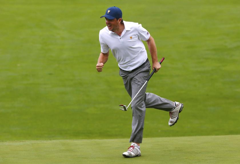 Keegan Bradley of the US celebrates after sinking his putt on the 18th hole during the  Foursome matches for the 2013 Presidents Cup golf tournament at Muirfield Village Golf Club in Dublin, Ohio October 6, 2013. u00e2u20acu201d Reuters pic