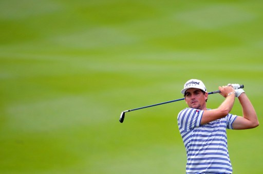 Keegan Bradley of the US watches his fairway shot on the 10th hole on during the second round of the CIMB Asia Pacific Classic golf tournament at the Kuala Lumpur Golf and Country Club (KLGCC) on October 25, 2013. u00e2u20acu201d AFP pic