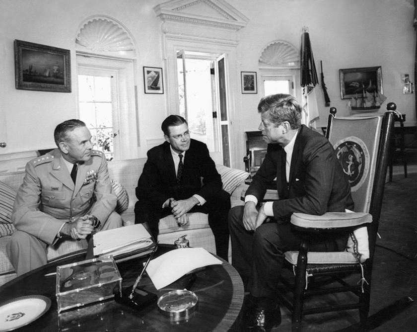 Then U.S. President Kennedy (R) meets with then Secretary of Defense Robert S. McNamara and Chairman of the Joint Chiefs of Staff General Maxwell D. Taylor (L) in the Oval Office at the White House in Washington in this October 2, 1963 handout photo provi