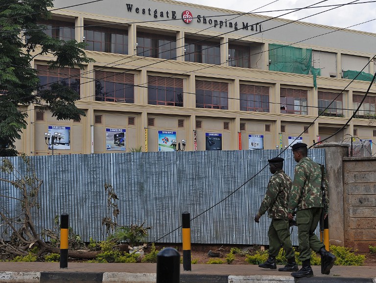 Police officers walk past the Westgate mall in Nairobi on September 28, 2013. u00e2u20acu201d AFP pic
