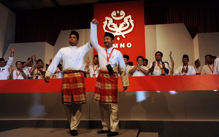 Khairy Jamaluddin (right) raises the hand of runner-up Mukhriz Mahathir as he celebrates his victory in Kuala Lumpur on March 25, 2009. u00e2u20acu201c AFP pic