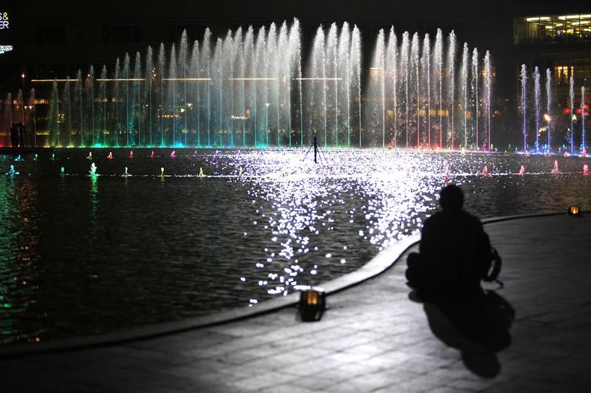 People taking pictures of the fountain light show at the KLCC park. u00e2u20acu201d Picture by Choo Choy May