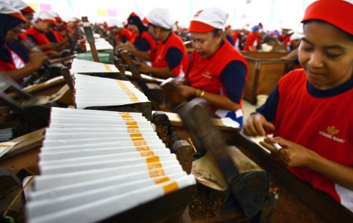 In this photograph taken on June 24, 2010, Indonesian women produce clove cigarettes in a tobacco factory in Malang in East Java. u00e2u20acu201d AFP pic