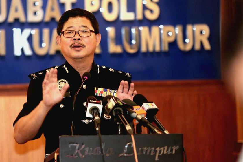 Kuala Lumpur CID chief Datuk Ku Chin Wah gestures when speaking to reporters on August 6, 2013 about latest developments in the investigations into the Hussain Ahmad Najadi murder. u00e2u20acu201d Picture by Saw Siow Feng