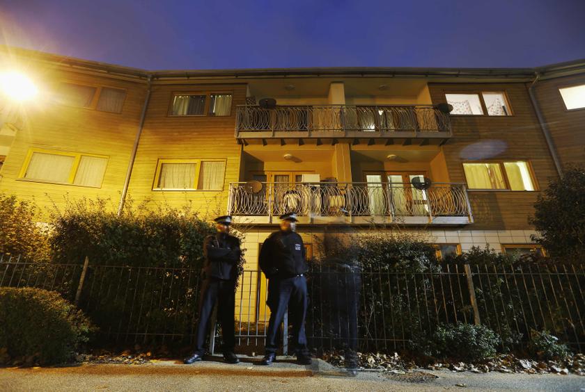 Police stand guard at a property in Brixton in the Borouogh of Lambeth, south London November 23, 2013. u00e2u20acu201d Reuters pic