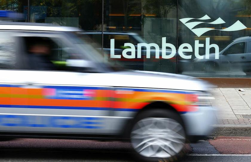 A police car passes a Lambeth sign on a council building in south London November 22, 2013. u00e2u20acu201d Reuters pic
