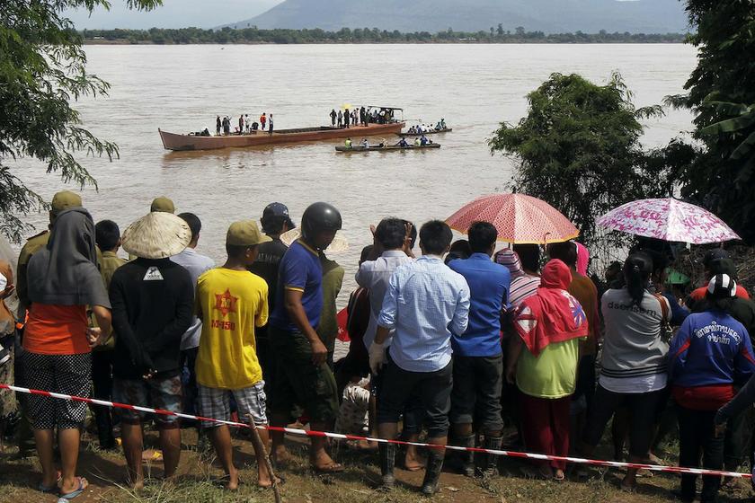 Villagers gather on the banks of Mekong river as rescue personnel on boats search the crash site of an ATR-72 turboprop plane, in Laos, near Pakse October 17, 2013. u00e2u20acu201d Reuters pic