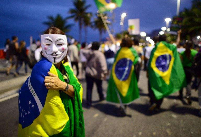 BRAZIL, Rio de Janeiro : Demonstrators protest for better public services, a new political system and against the Brazilian PEC37 draft law, a proposed constitutional amendment that would take away the power of independent public prosecutors to probe crim