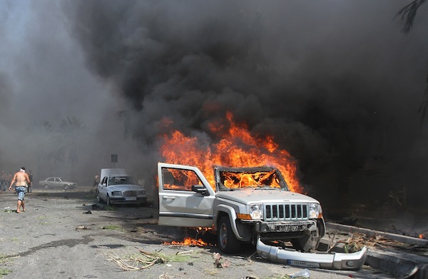 A car burns outside one of two mosques hit by explosions in Lebanonu00e2u20acu02dcs northern city of Tripoli, August 23, 2013. u00e2u20acu201d Reuters pic