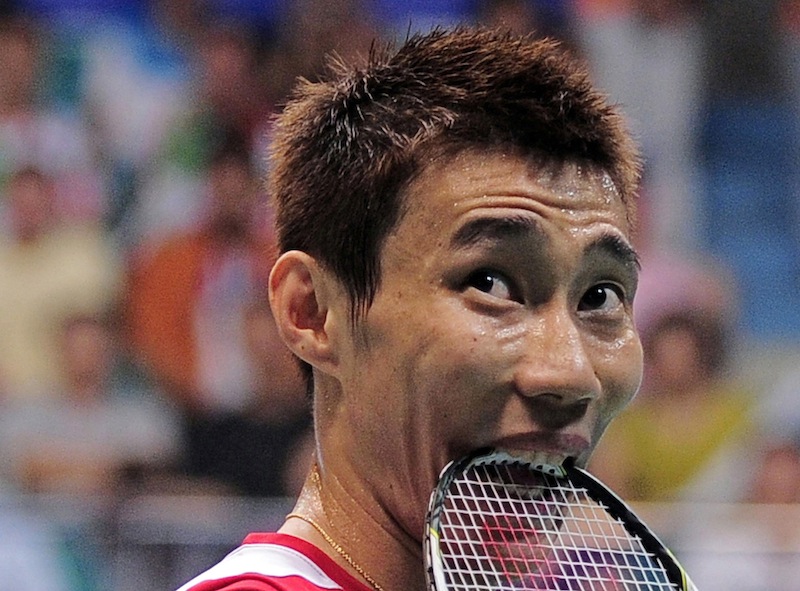 Malaysiau00e2u20acu2122s Lee Chong Wei bites his racket during his menu00e2u20acu2122s singles final against Chinau00e2u20acu2122s Lin Dan at the 2013 Badminton World Championships in Guangzhou August 11, 2013. u00e2u20acu201d Reuters pic