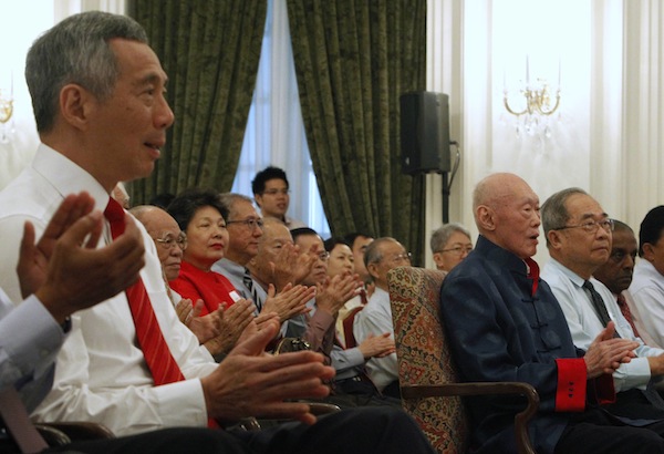 Singaporeu00e2u20acu2122s former Prime Minister Lee Kuan Yew (3rd right) receives an applause from guests including his son Prime Minister Lee Hsien Loong (left) during his book launch at the Istana in Singapore August 6, 2013. u00e2u20acu201d Reuters pic