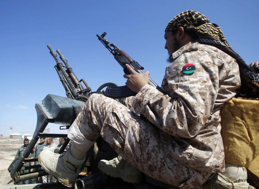 A member of the coast battalion of the Libya Shield Force Western Brigade sits on a truck with a mounted anti-aircraft gun in the western suburbs of the city of Tripoli August 12, 2013.u00c2u00a0u00e2u20acu201c Reuters pic