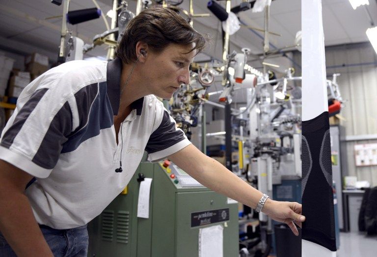An employee checks a Booster at the production unit in Saint-Etienne, southeastern France.