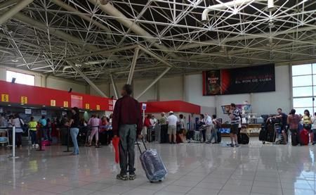 Cubans line at the check-in lobby at Havana's Jose Marti International Airport October 16, 2012