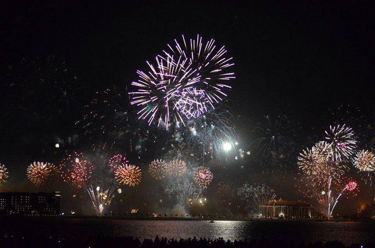 Fireworks explode over Palm Jumeirah in Dubai on January 1, 2014, breaking the Guinness world record for the largest ever pyrotechnic display on New Yearu00e2u20acu2122s Eve with a show involving more than half a million fireworks AFP
