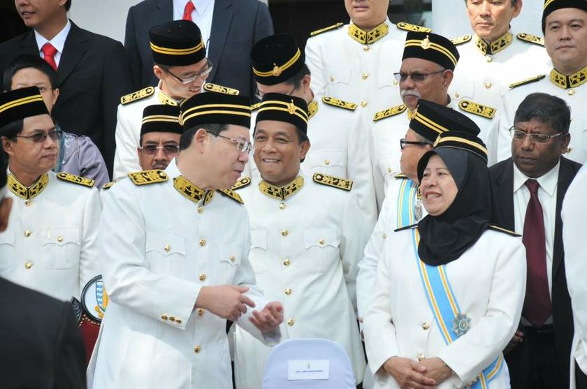 Penang Chief Minister Lim Guan Eng talks with Penang Opposition Leader Jahara Hamid before the group photo session at the Penang State Assembly sitting in George Town on July 2, 2013. u00e2u20acu201d Picture by K.E. Ooi