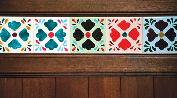 The colourful tiles on the wall are handpainted by the Lim sisters and their mother in a family-bonding project