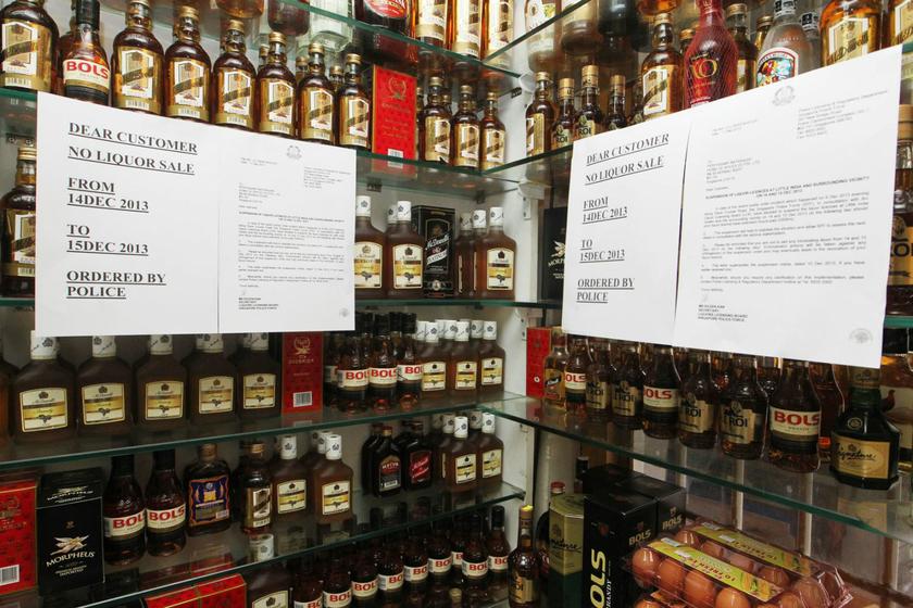A shop in Little India has put up notifications of a two-day ban in the sale and consumption of alcohol in Little India on shelves displaying alcoholic drinks on December 13, 2013. Picture by Ooi Boon Keong/Today