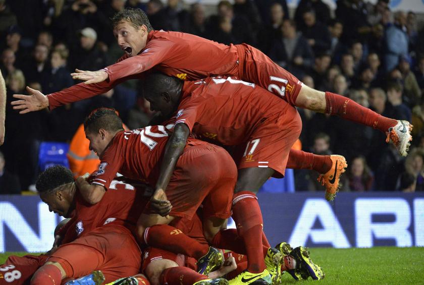 Liverpool's players celebrate after scoring a goal during their English Premier League  match against Tottenham Hotspur at White Hart Lane in London December 15, 2013.u00c2u00a0u00e2u20acu201d Reuters pic