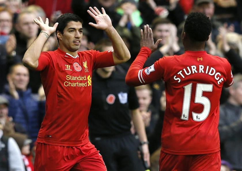 Liverpool’s Luis Suarez celebrates with teammate Daniel Sturridge after scoring a goal against Fulham during their English Premier League match at Anfield in Liverpool, northern England November 9, 2013. — Reuters pic