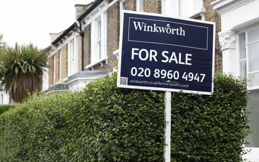 An estate agentu00e2u20acu2122s sign is posted outside a terraced house in north London on August 2, 2013. u00e2u20acu201d Reuters pic
