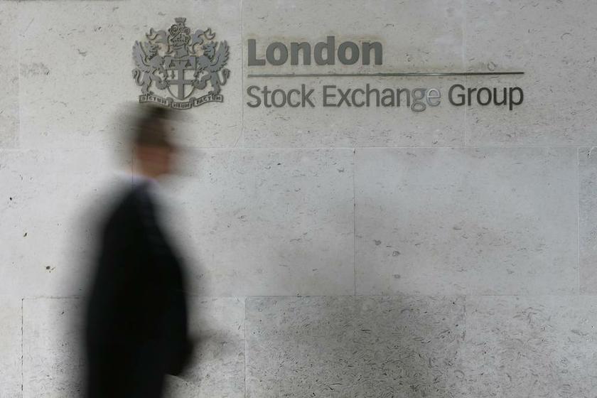 A man walks past the London Stock Exchange in the City of London October 11, 2013. u00e2u20acu201d Reuters pic