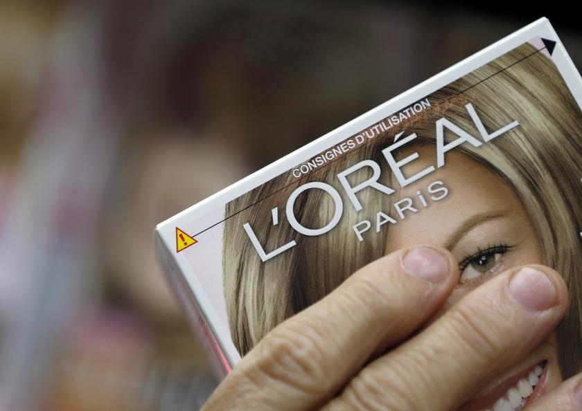 A customer holds a L'Oreal cosmetics group product in an supermarket in Lanton, southwestern France, August 30, 2013. u00e2u20acu201d Reuters pic