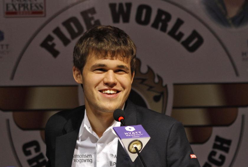 Norway's Magnus Carlsen smiles as he speaks with the media at a news conference after clinching the FIDE World Chess Championship in the southern Indian city of Chennai November 22, 2013. u00e2u20acu201d Reuters pic