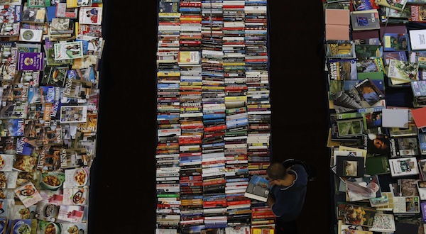 A customer shops for books at a shopping mall in Kajang outside Kuala Lumpur September 8, 2013. u00e2u20acu201d Reuters pic