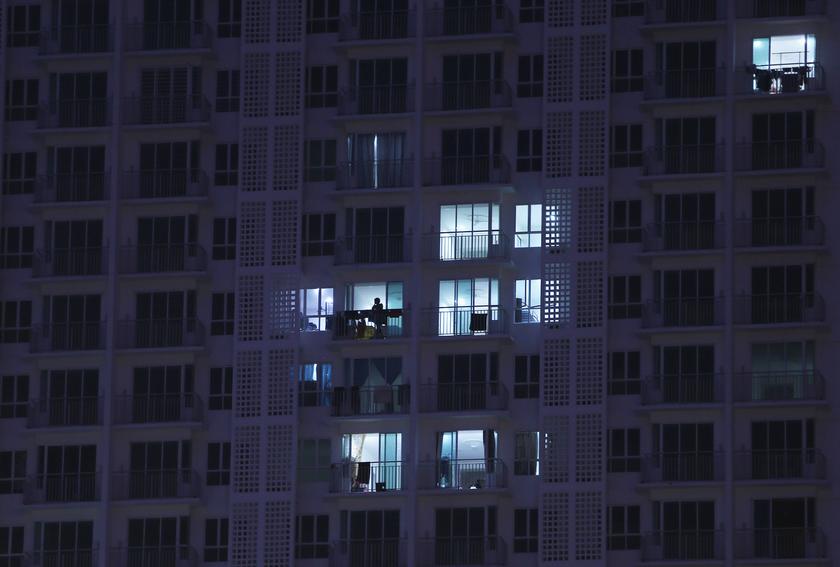 Residents of a condominium complex switch on their lights in Shah Alam outside Kuala Lumpur December 2, 2013. u00e2u20acu201d Reuters pic