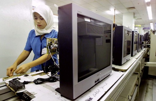 File photo of a worker preparing colour television sets on a production line at Japanese giant Sony Corp.u00e2u20acu2122s Malaysian factory in Kajang. u00e2u20acu201d AFP pic
