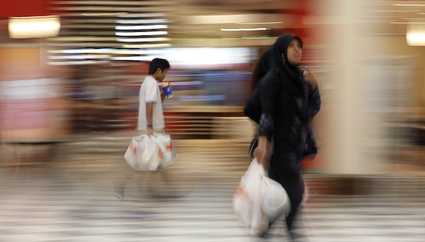 Customers leave with their groceries after shopping at a supermarket in Kuala Lumpur August 28, 2013. u00e2u20acu201d Reuters pic