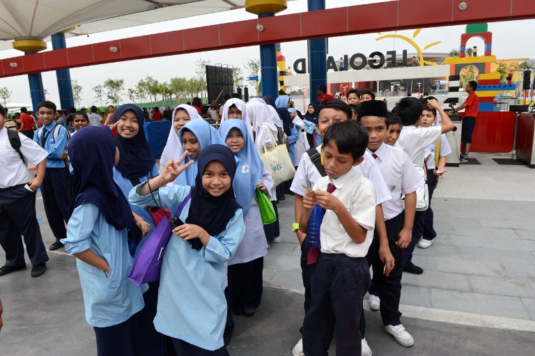  This photograph taken on September 14, 2012 shows school children waiting to enter Malaysia's Legoland Park in Johor Baru. u00e2u20acu201c AFP pic