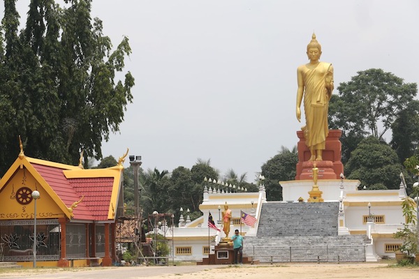 Wat Pikulthong in Kg Terbak, Tumpat is famed for its giant Standing Buddha statue.