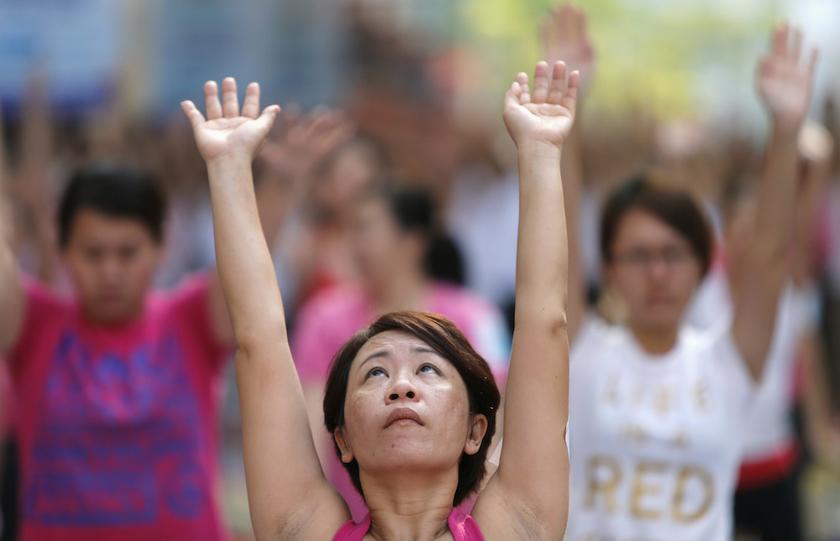 A participant exercises during Mega Yoga Day in Kuala Lumpur October 27, 2013. u00e2u20acu201d Reuters pic
