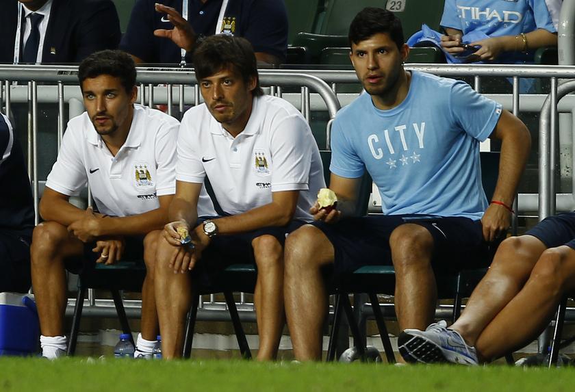 Manchester City players (from left) Jesus Navas, David Silva and Sergio Aguero, watch their team play against South China in Hong Kong July 24, 2013. u00e2u20acu201c Reuters pic